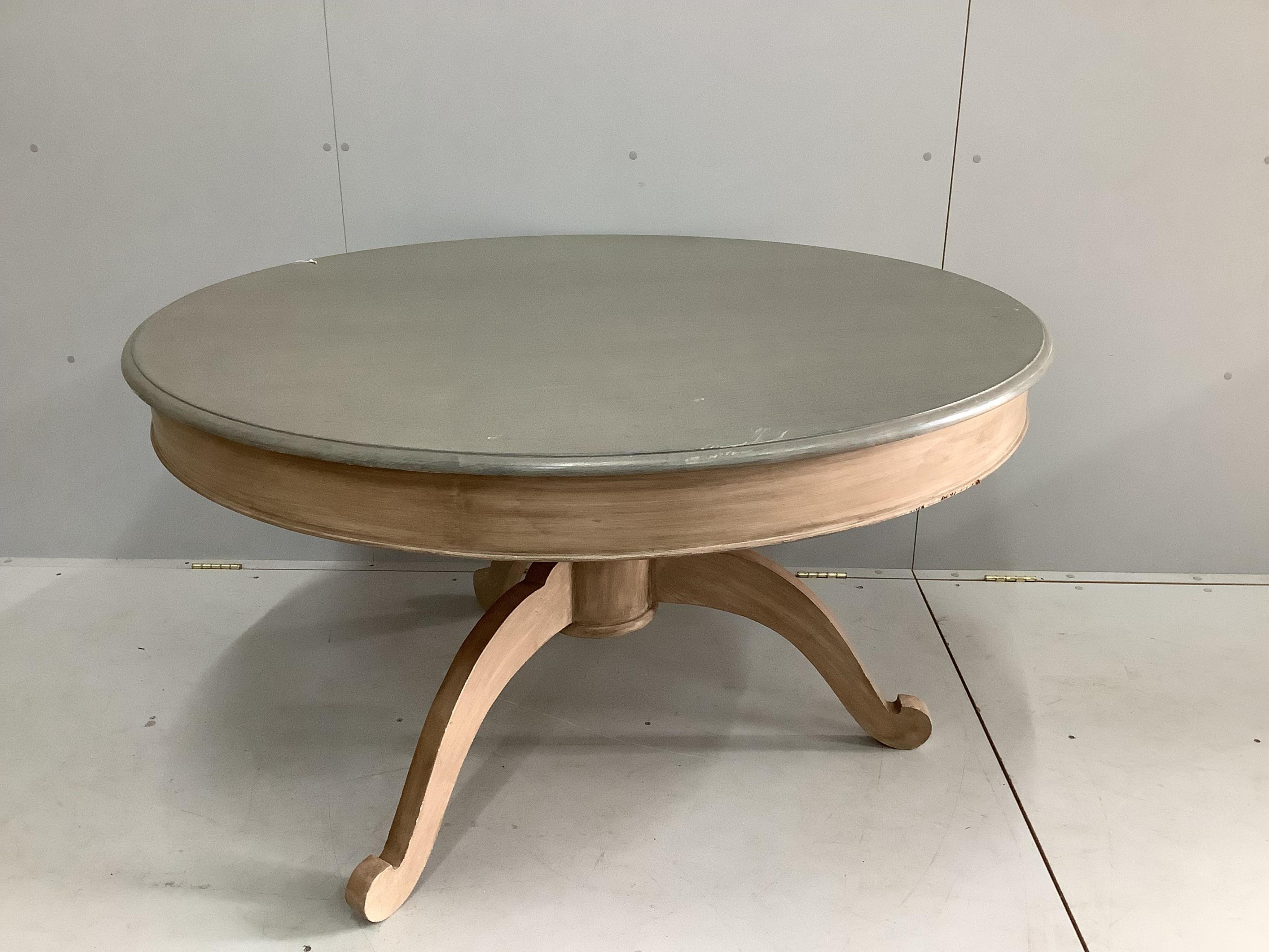 An Oka Furniture 'Arthur' circular table, diameter 130cm, height 74cm and six Oka French style limed oak chairs. Condition - good